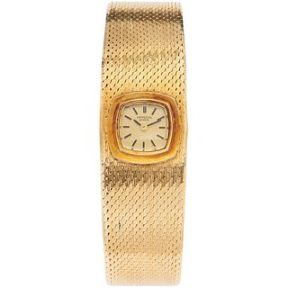 UNIVERSAL GENEVE LADY WATCH IN 18K YELLOW GOLD WITH SAFETY CHAIN IN 10K YELLOW GOLD  Movement: manual. Weight: 56.8 g