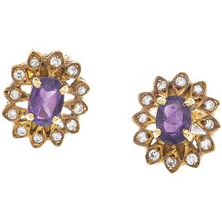 PAIR OF STUD EARRINGS WITH AMETHYSTS AND DIAMONDS IN 14K YELLOW GOLD Oval cut amethysts ~0.80 ct, Brilliant cut diamonds ~0.20ct
