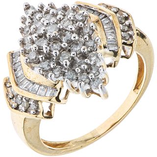 RING WITH DIAMONDS IN 10K YELLOW GOLD Brilliant and baguette cut diamonds ~1.20 ct. Weight: 6.8 g. Size: 8 ½