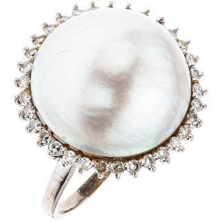 RING WITH HALF PEARL AND DIAMONDS IN PALLADIUM SILVER White half pearl, 8x8 cut diamonds ~0.30 ct. Weight: 7.6 g. Size: 9