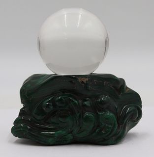 Carved Malachite Base Suspending a Crystal Ball.