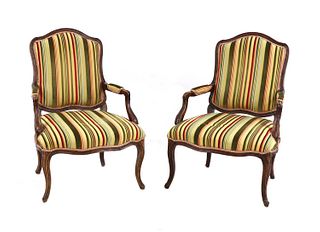 A pair of French Louis XV beech fauteuils,