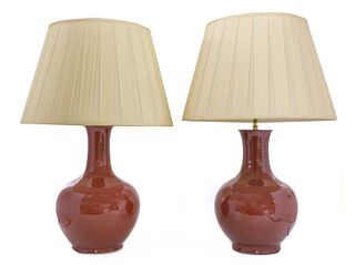 A pair of Chinese-style porcelain sang-de-boeuf table lamps,