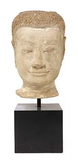 A carved stone head of Buddha,