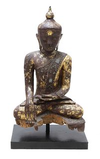 A wooden and lacquered Shakyamuni Buddha,