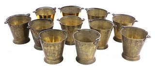 A set of eleven brass buckets,