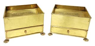 A pair of large brass ashtrays,