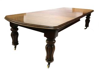 A Victorian walnut extending dining table