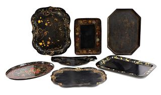 A collection of Regency and later papier mâché lacquer trays,