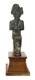 An Egyptian bronze and clay figurine of Osiris,