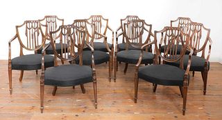 A set of ten mahogany shield back dining chairs,
