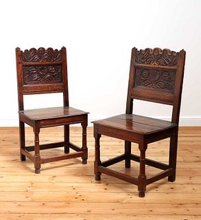 A pair of Charles II oak backstools,