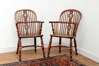 A pair of yew and elm low hoop back Windsor chairs,