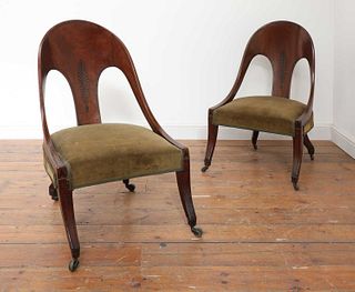 A pair of Regency mahogany klismos chairs,