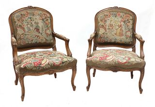 A pair of French Louis XV-style beech fauteuils,