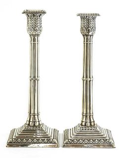A pair of silver cluster column table candlesticks,