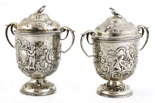 A pair of Continental silver urns,