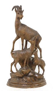 A Black Forest carved linden wood figure group of mountain goats,