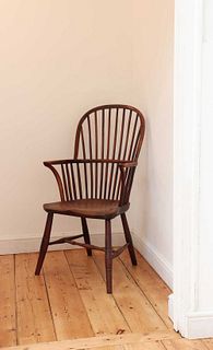 A yew and elm high hoop back Windsor chair,
