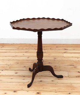 An oak octagonal tripod table,