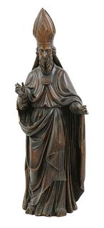 A Continental carved wood figure of a bishop,