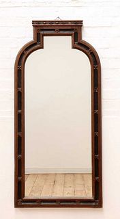 A Gothic oak and ebonised wall mirror,