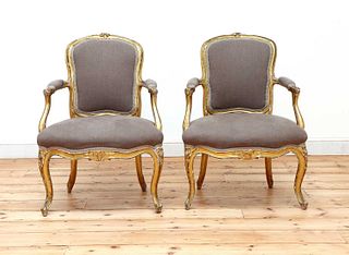 A pair of gilt-framed Louis XV-style armchairs,