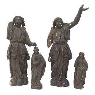 A pair of early carved wooden angels,