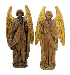 A pair of carved wood angel figures,