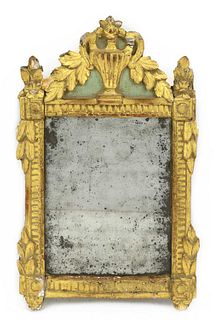 A painted and gilt wall mirror,
