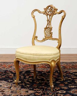A French Louis XV-style giltwood salon chair,