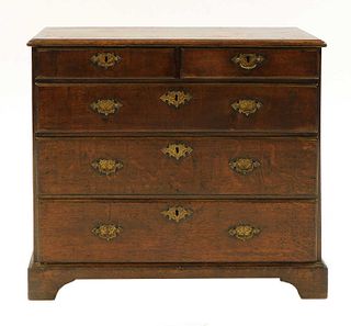 A small oak chest of drawers,