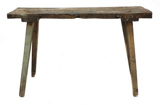 A rustic oak workbench,