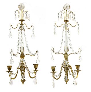 A pair of Continental polished brass and cut-glass wall lights with lustres