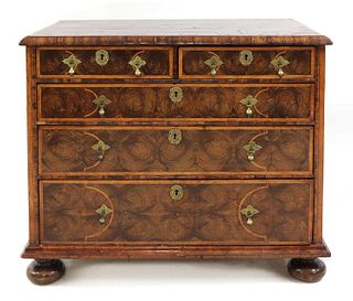A William and Mary oyster veneered laburnum and fruitwood inlaid chest of drawers