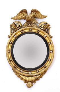 A Regency period circular gilt eagle wall mirror,