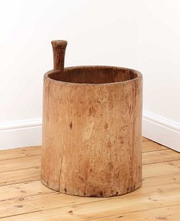 A primitive dug-out wooden storage container,
