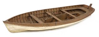 A wooden model rowing boat,