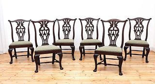 A set of six Georgian-style walnut dining chairs,