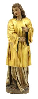 A Continental carved wood figure of a saint,