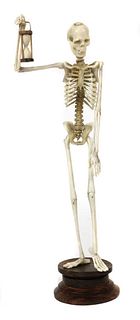 A carved bone and ivory figure of a skeleton,