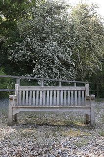 A large teak garden bench,