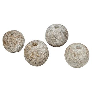 Set of Four Primitive Carved Stone Balls