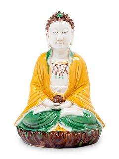 A Chinese Sancai Glazed Biscuit Figure of Buddha Shakyamuni