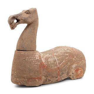 A Chinese Pottery Figure of a Recumbent Horse