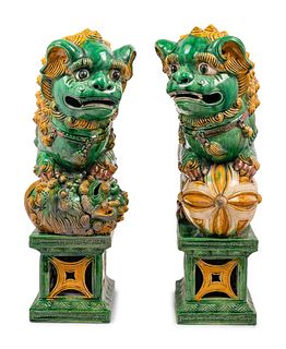 A Pair of Chinese Sancai Glazed Porcelain Figures of Fu Lions