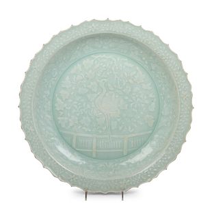 A Chinese Molded Celadon Glazed Porcelain Charger