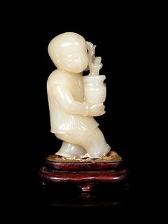 A Chinese Pale Celadon Jade Figure of a Boy