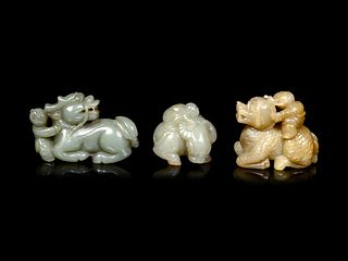 Three Chinese Celadon Jade Figures of Boys