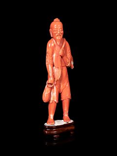 A Chinese Red Coral Figure of a Fisherman